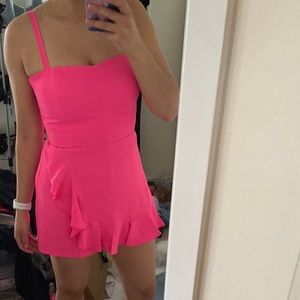 Bright Pink Revolve Romper Size Med.